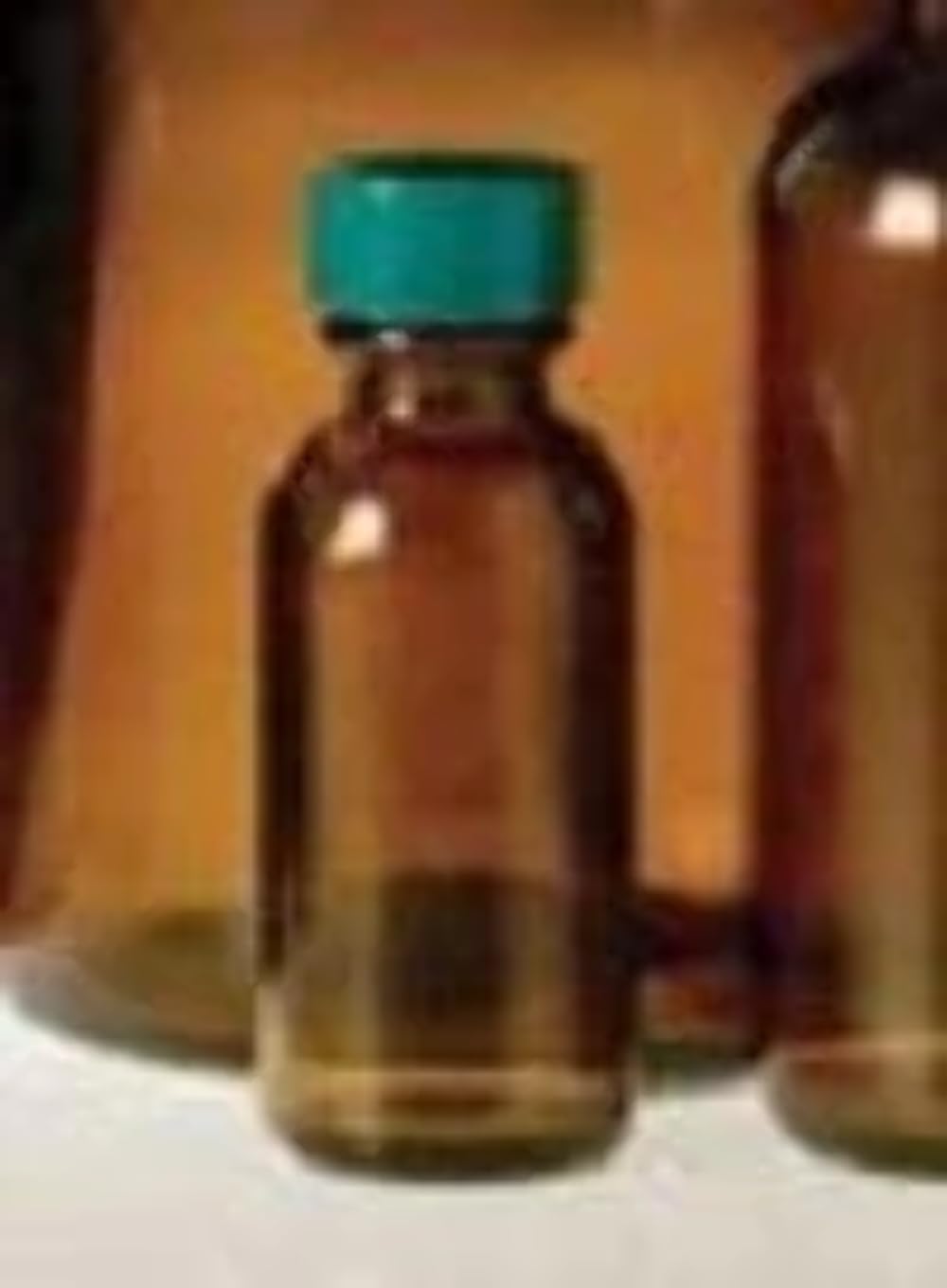 Boston 1 oz Amber Glass Round Bottle with Cap